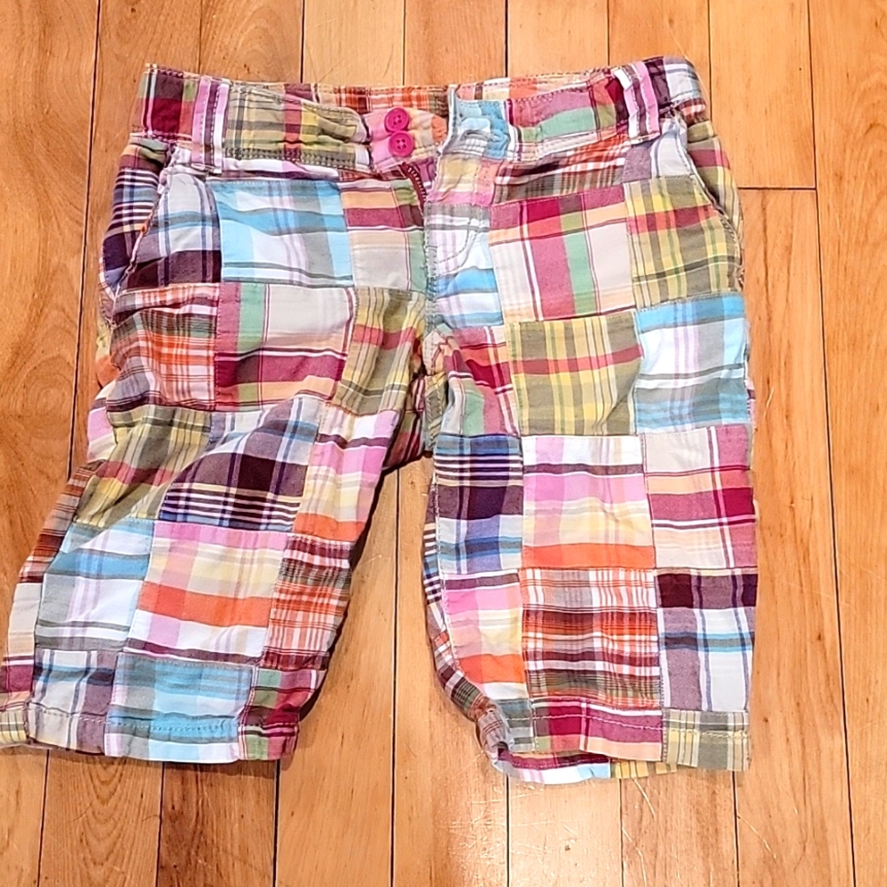 Bermuda length shorts.